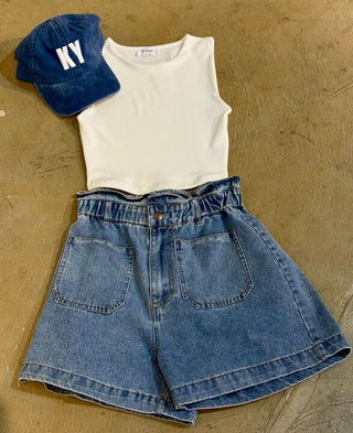 Blue denim hat with "KY" on it, white tank, and denim shorts