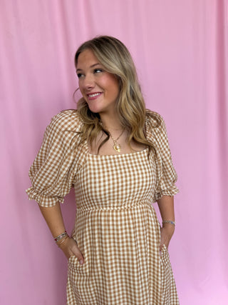 girl wearing gingham dress