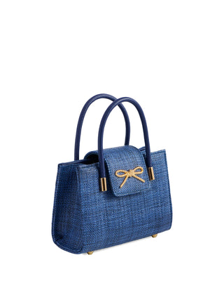 Blue handbag with a bow detail on a white background