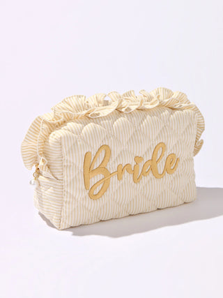 Beige toiletry bag with 'Bride' text on a white background