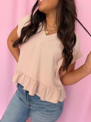 girl wearing a pink top