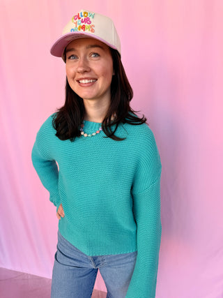 woman wearing a blue sweater 