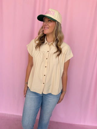 girl wearing a beige top