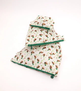 Three reusable fabric pet grooming brushes with a brown and green duck print, stacked on a white background.