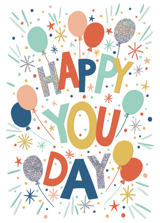 Colorful 'Happy You Day' text with balloons and confetti on a white background