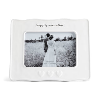 White photo frame with 'happily ever after' text and a couple in a field on a white background