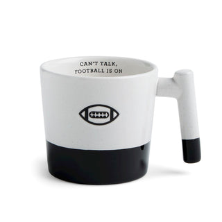 White mug with black accent and football-themed text on a white background