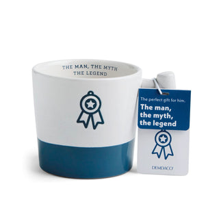 White mug with blue accent and 'The Man, The Myth, The Legend' text,DEMDCO branded tag.