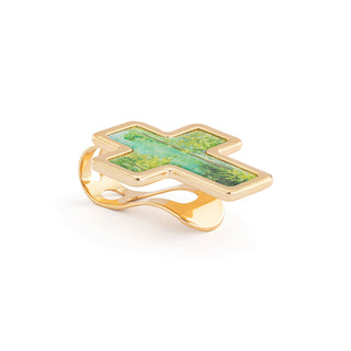 Gold ring with a green stone cross on a white background