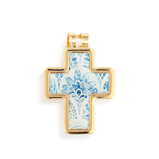 Gold cross pendant with blue floral design on a white background