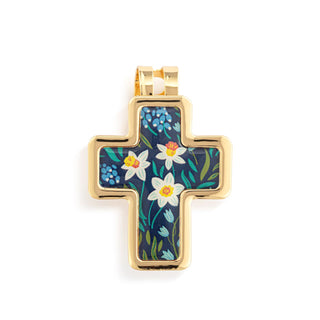 Gold cross pendant with floral design on a white background