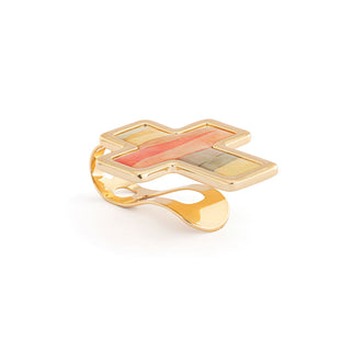 Gold cross-shaped ring with a colorful center on a white background