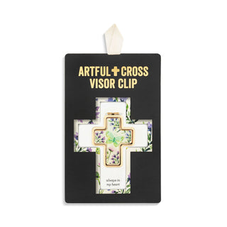 Artful cross visor clip with floral design on a black card