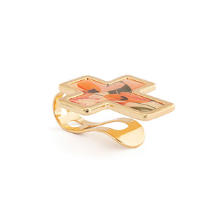 Gold ring with a colorful cross design on a white background