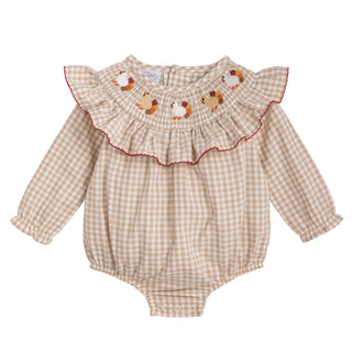 Beige checkered baby romper with embroidered details on a white background