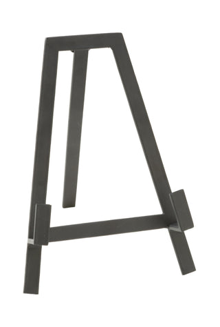 Black metal easel on a white background