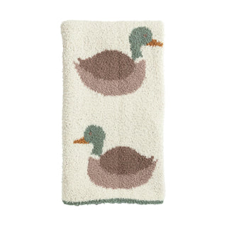Textured blanket with duck designs on a white background