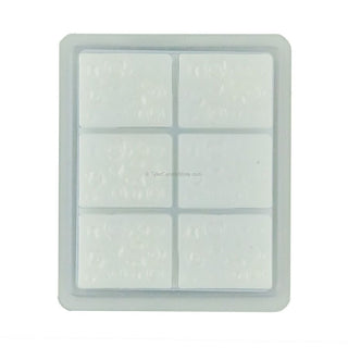 Silicone ice cube tray with six compartments on a white background