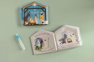 Children's book with Nativity scene illustrations on a light green background