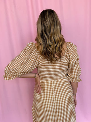 girl wearing gingham dress