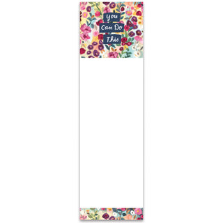 Notepad with floral design and motivational text on a white background