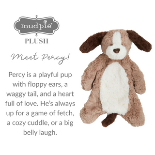 Plush dog toy named Percy with text describing its features and brand 'mudpie'.