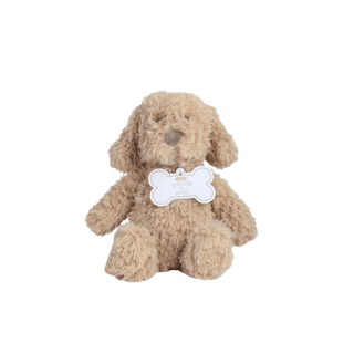 Plush dog toy with a bone-shaped tag on a white background