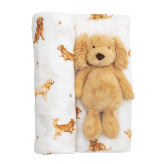 Plush toy lion on a blanket with dog illustrations