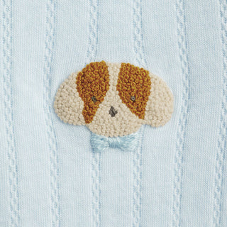 Dog made of french knots on a blue background