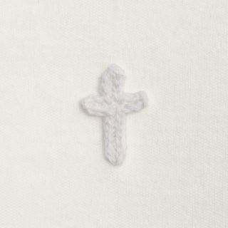 Decorative cross on a textured white background