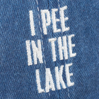 Embroidered text 'I PEE IN THE LAKE' on blue fabric
