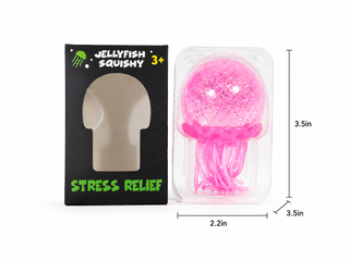 A pink jellyfish stress relief squishy toy shown next to its black retail box with size annotations (3.5 in height, 2.
