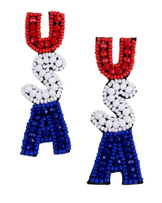 Beaded earrings shaped like the letters 'U', 'S', and 'A' in red, white, and blue on a white background.