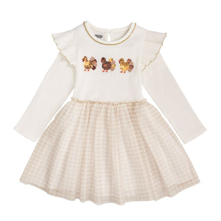 Children's dress with long sleeves and a checkered skirt on a white background