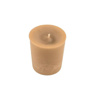Beige candle on a white background