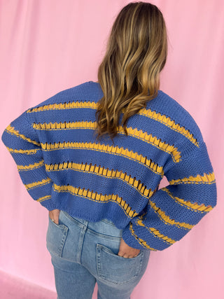 girl wearing a striped sweater 