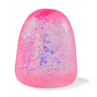 A pink, dome-shaped textured object with embedded iridescent glitter, shown on a clean white background.