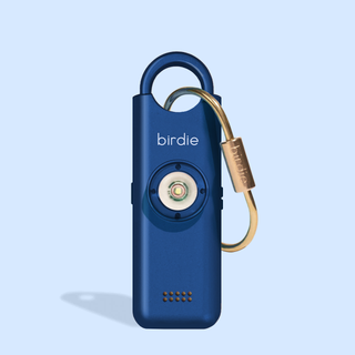 Blue device with gold carabiner on a light blue background