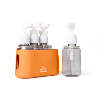 Orange carrying case with multiple bottles and pumps on a white background