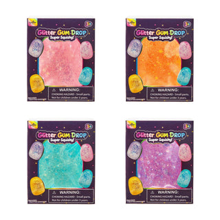 Four boxes of Glitter Gum Drop Super Squiggle! craft kits arranged in a 2x2 grid on a white background. Each box shows a different glittery gum drop color: pink, orange, teal, and purple, with colorful eggs and warning labels.