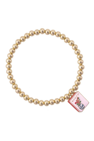Bracelet with a decorative tag on a white background