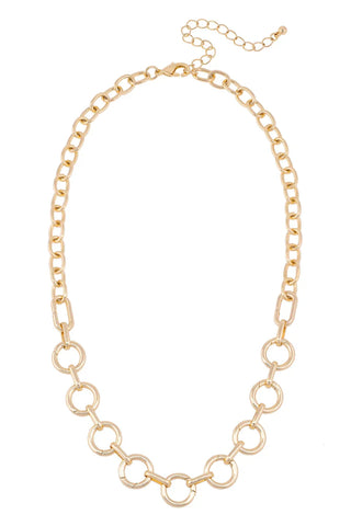 Gold chain necklace on a white background