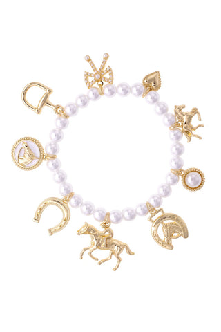 Bracelet with gold charms and white beads on a white background