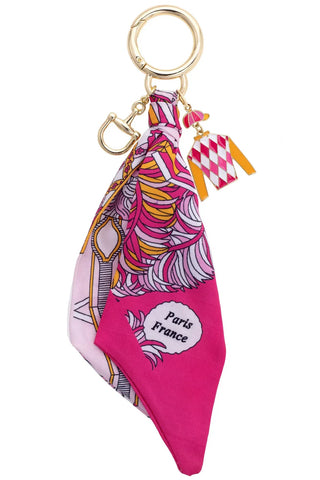 Keychain with a pink scarf and 'Paris France' label on a white background