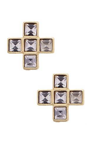 Gold cross-shaped earrings with clear gemstones on a white background