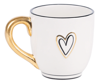 White mug with gold handle and heart design on a white background