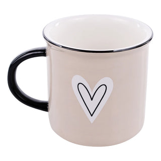 Beige mug with a black heart design on a white background