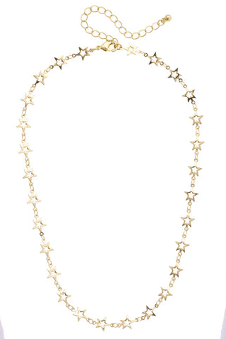 Gold star necklace on a white background