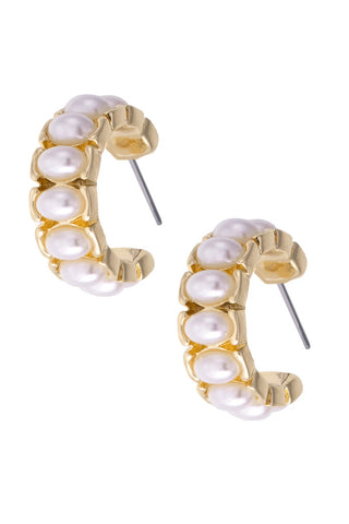 Gold hoop earrings with pearl-like stones on a white background
