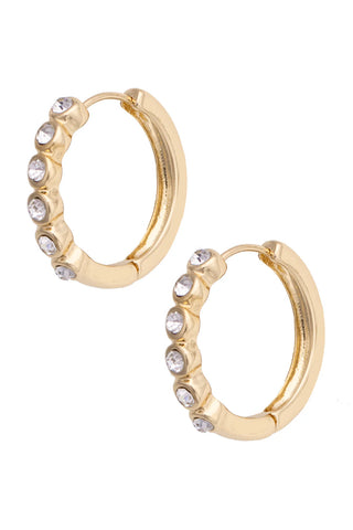 Gold hoop earrings with embedded stones on a white background
